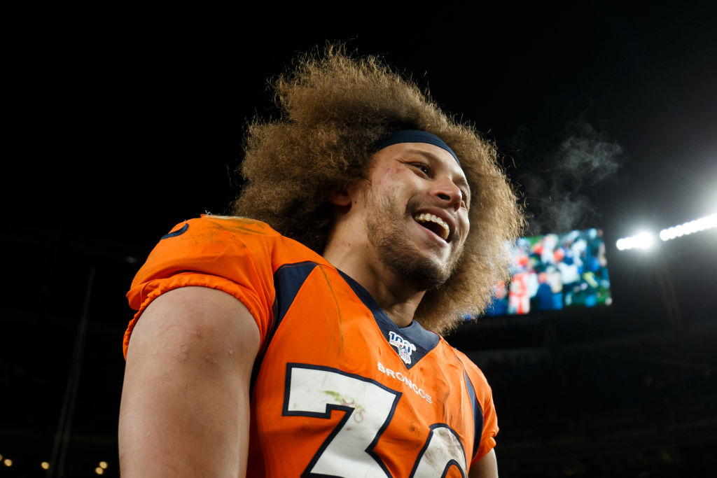 DENVER, CO - DECEMBER 29:  Running back Phillip Lindsay #30 of the Denver Broncos smiles on the fie...