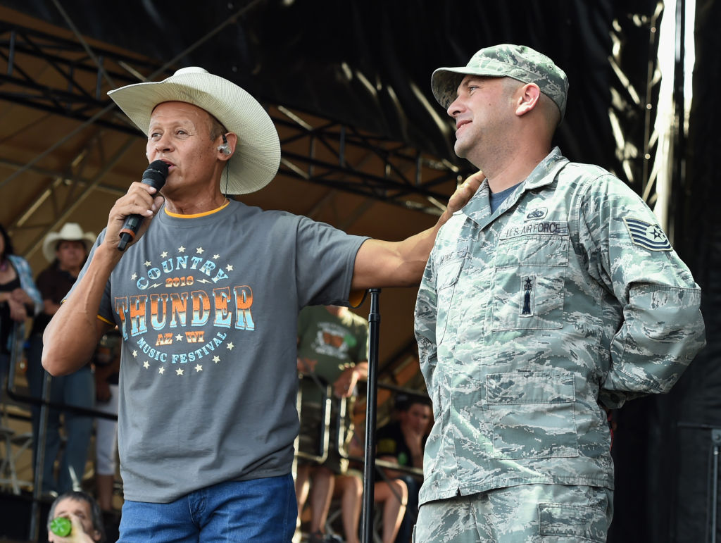 FLORENCE, AZ - APRIL 06:  Singer/Songwriter Neal McCoy introduces SGT. John Moyle Air Force  during...