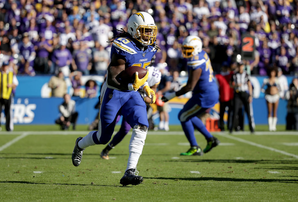 CARSON, CALIFORNIA - DECEMBER 15: Melvin Gordon #25 of the Los Angeles Chargers carries the ball ag...