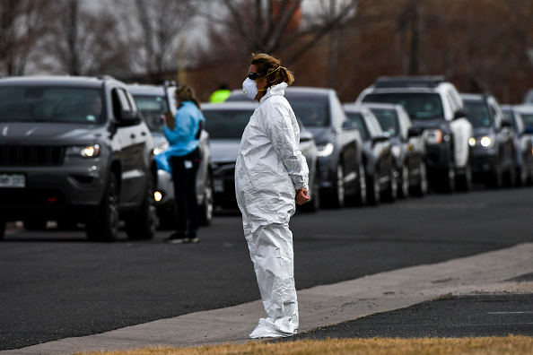 DENVER, CO - MARCH 12: A healthcare worker from the Colorado Department of Public Health and Enviro...