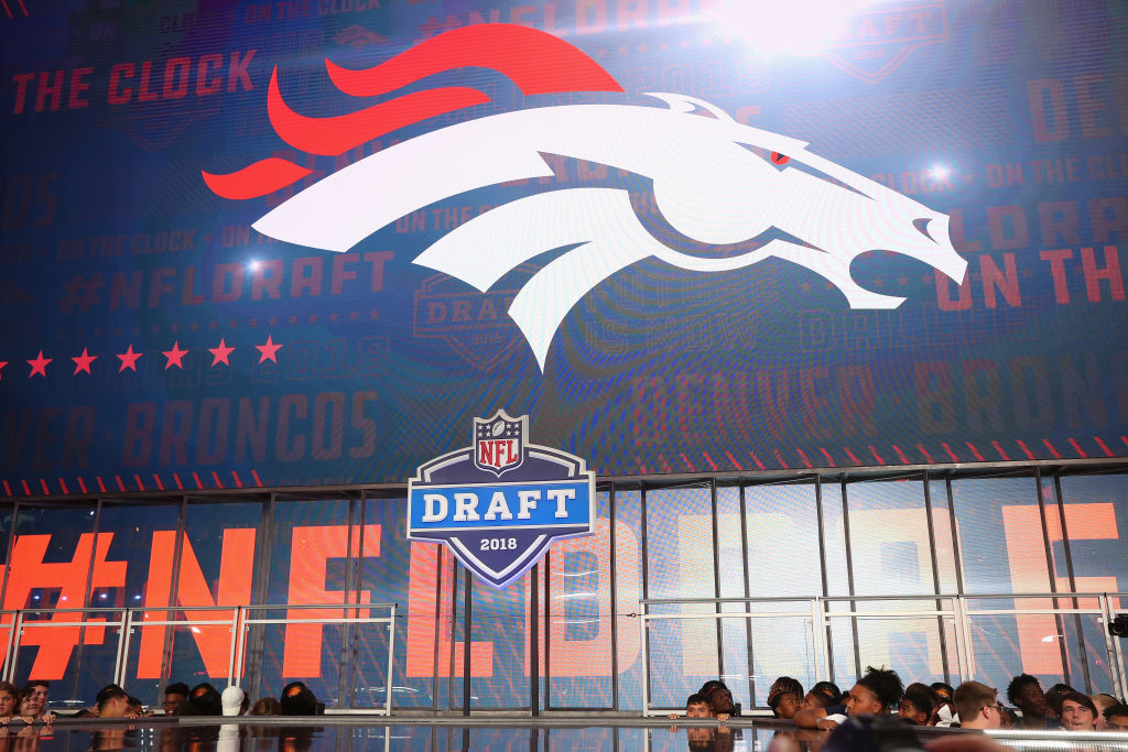 ARLINGTON, TX - APRIL 26:  The Denver Broncos logo is seen on a video board during the first round ...
