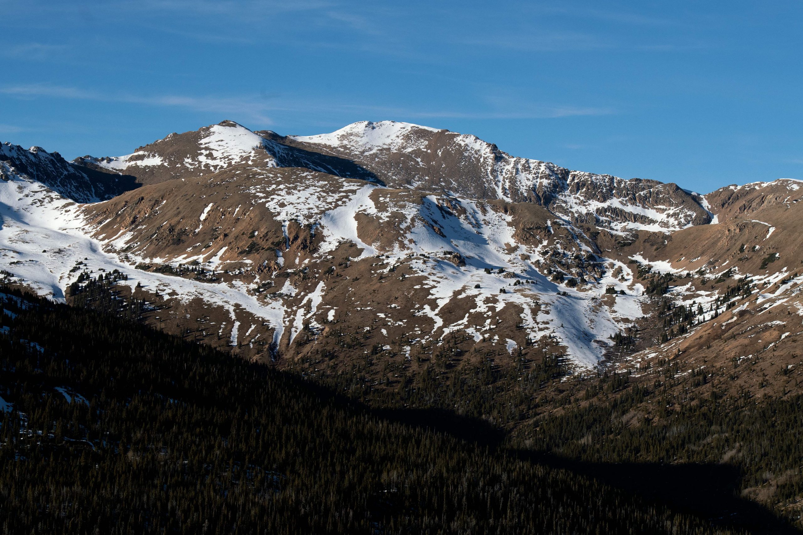 A lack of early season snow leaves mountain peaks in Clear Creek County, Colorado exposed on Decemb...