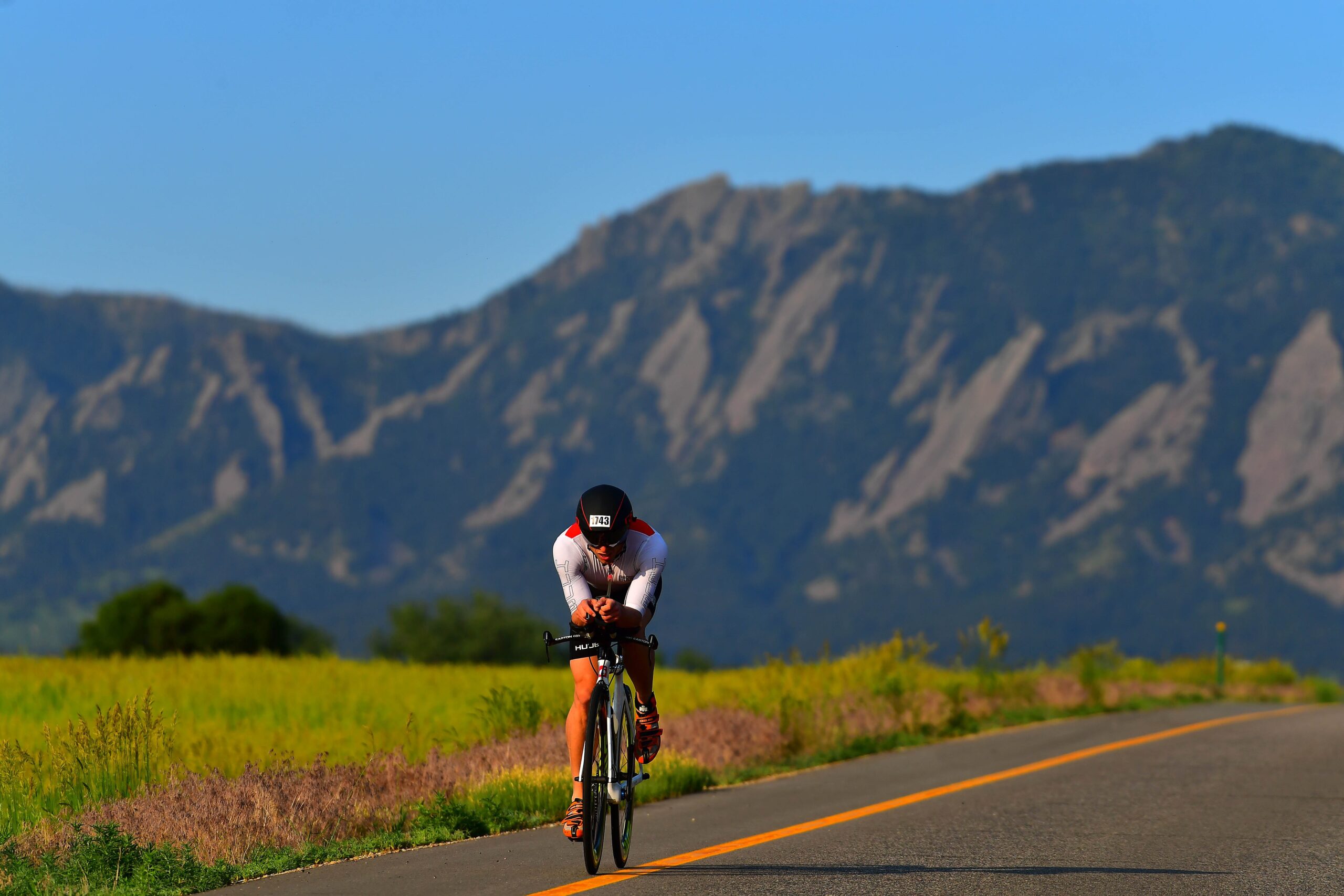 BOULDER, CO - JUNE 10: A general view of a biker in front of the Flatirons during the IRONMAN Bould...