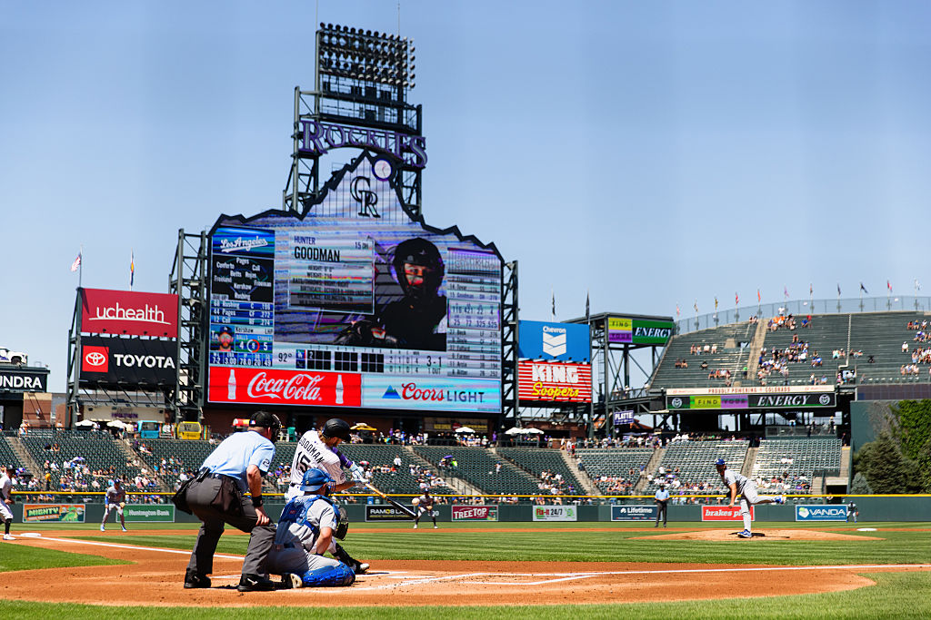 DENVER, CO - AUGUST 21:  Hunter Goodman #15 of the Colorado Rockies hits an RBI ground out in the f...