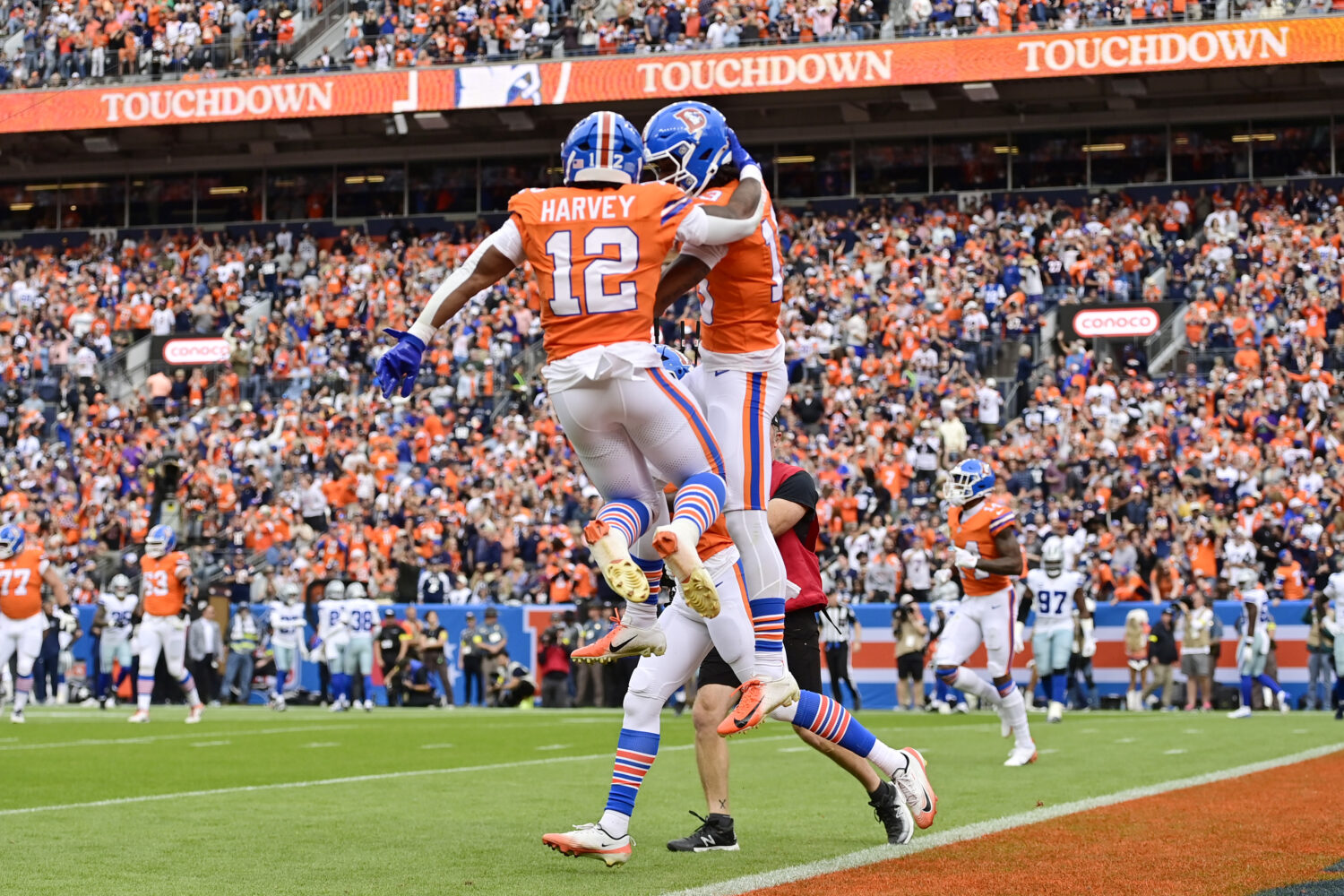 DENVER, COLORADO - OCTOBER 26: RJ Harvey #12 and Pat Bryant #13 of the Denver Broncos celebrate aft...