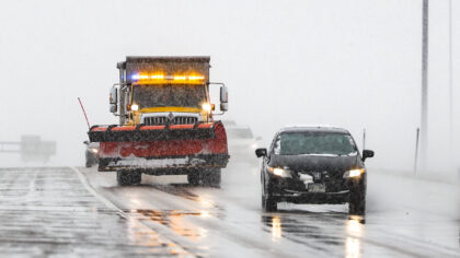 DENVER, CO - MARCH 13: A snow plow drops salt on the road near Denver International Airport on Marc...