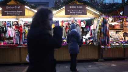 CHICAGO, ILLINOIS - DECEMBER 12: People shop for holiday items at the Christkindlmarket outside of ...