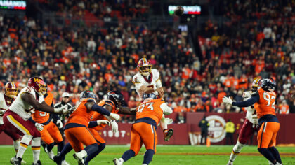 LANDOVER, MARYLAND - NOVEMBER 30:  Marcus Mariota #8 of the Washington Commanders throws an interce...