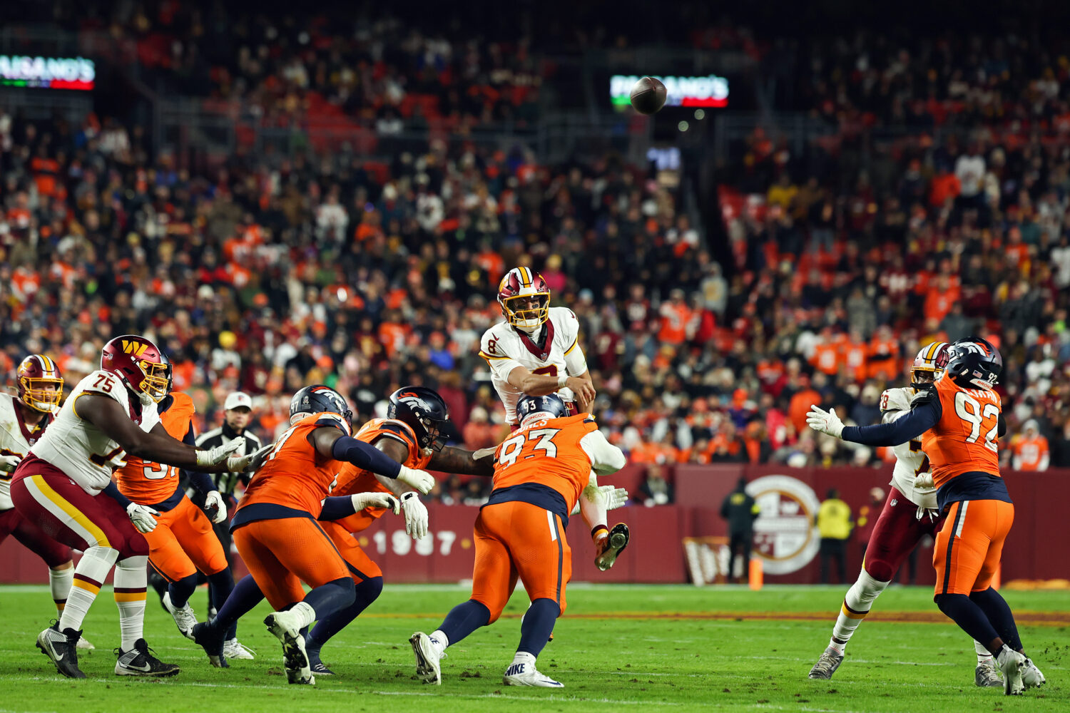 LANDOVER, MARYLAND - NOVEMBER 30:  Marcus Mariota #8 of the Washington Commanders throws an interce...