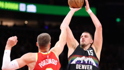 ATLANTA, GEORGIA - DECEMBER 05:  Nikola Jokic #15 of the Denver Nuggets attempts a shot against Kri...