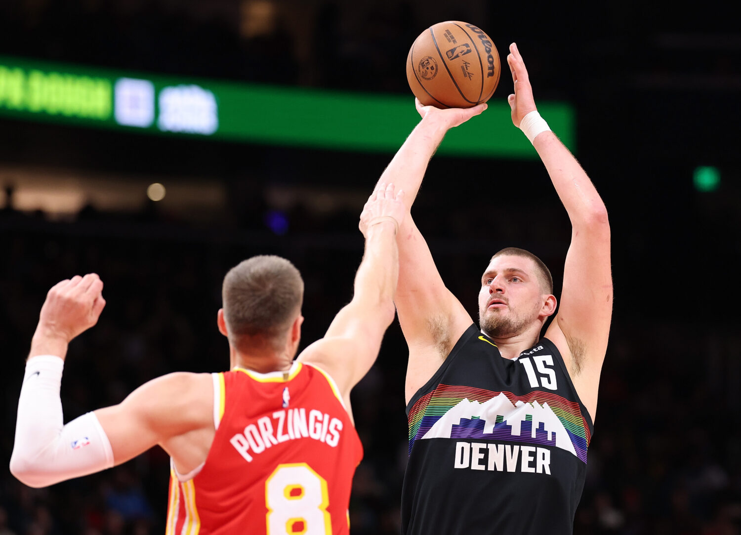 ATLANTA, GEORGIA - DECEMBER 05:  Nikola Jokic #15 of the Denver Nuggets attempts a shot against Kri...