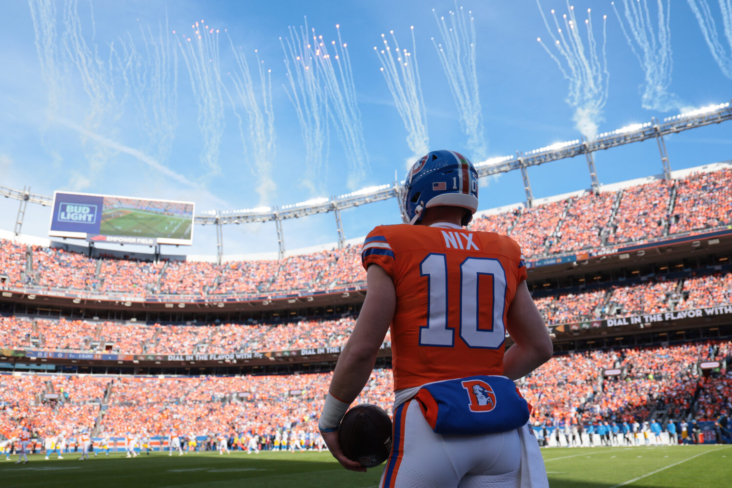 DENVER, COLORADO - JANUARY 04: Bo Nix #10 of the Denver Broncos looks on before the game against th...