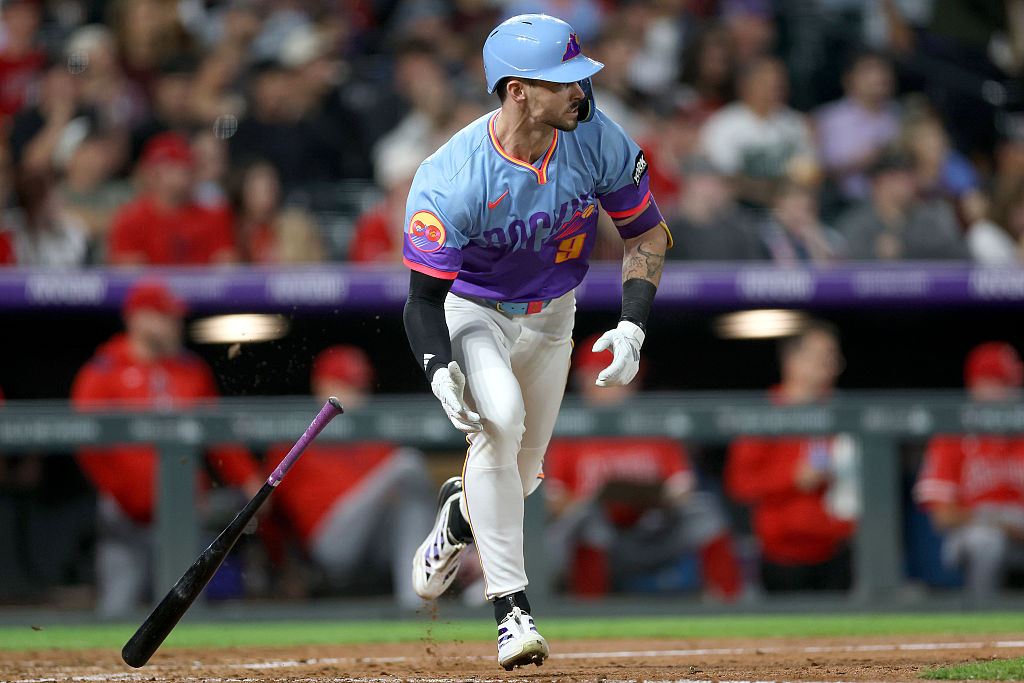 DENVER, COLORADO - SEPTEMBER 19: Brenton Doyle #9 of the Colorado Rockies hits a 2 RBI single again...