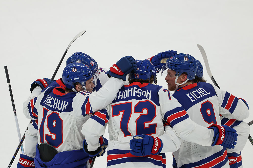 MILAN, ITALY - FEBRUARY 20: Tage Thompson #72 of Team United States celebrates with teammates after...