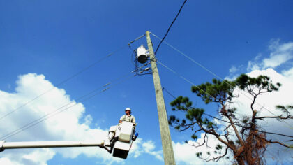 SEBASTIAN, FL - SEPTEMBER 28:  Mike Baker, a lineman for XCel Energy from Texas, works on restoring...