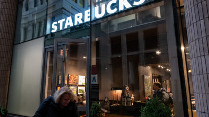 NEW YORK, NEW YORK - DECEMBER 02: A Starbucks coffee shop stands in Manhattan on December 02, 2025 ...