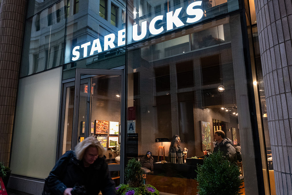 NEW YORK, NEW YORK - DECEMBER 02: A Starbucks coffee shop stands in Manhattan on December 02, 2025 ...