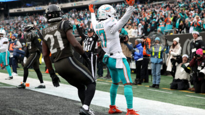 EAST RUTHERFORD, NEW JERSEY - DECEMBER 07: Jaylen Waddle #17 of the Miami Dolphins celebrates with ...