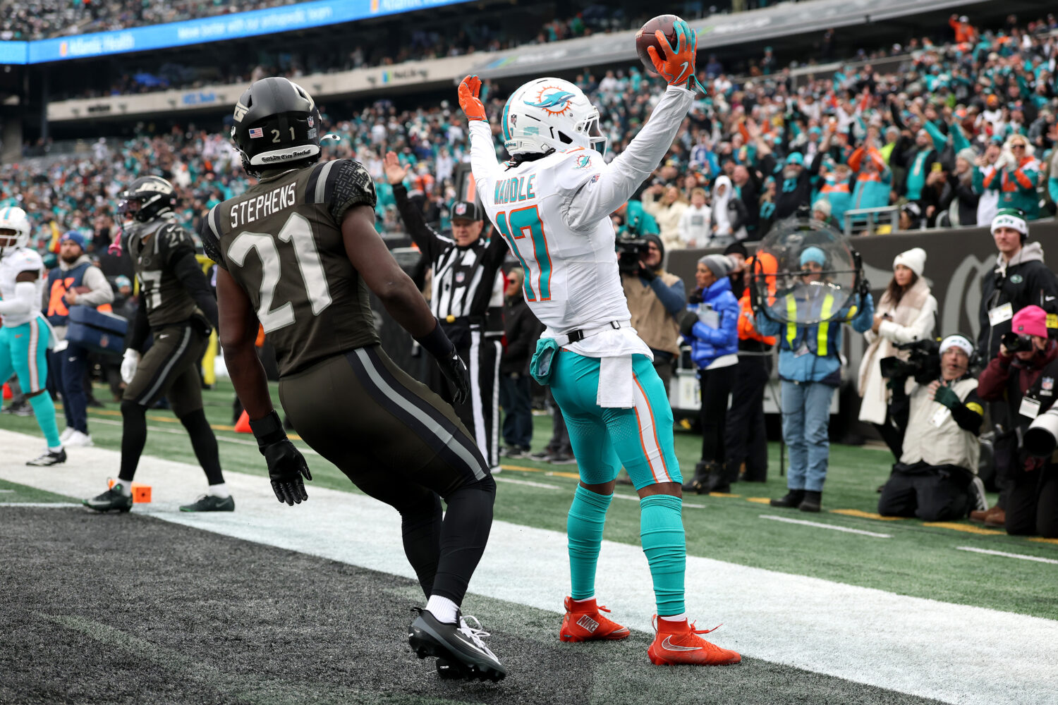 EAST RUTHERFORD, NEW JERSEY - DECEMBER 07: Jaylen Waddle #17 of the Miami Dolphins celebrates with ...