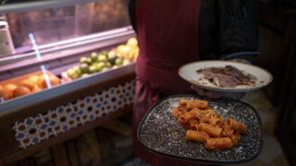 ROME, ITALY - DECEMBER 17: Pasta carbonara dishes and amatriciana are carried to tables at Saltimbo...