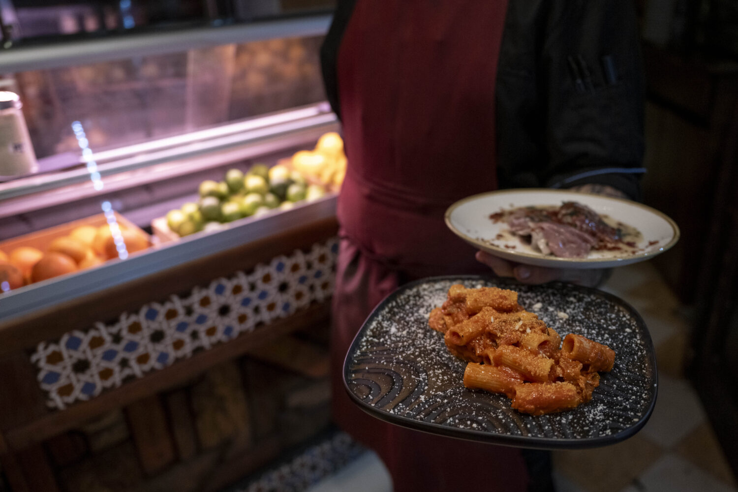 ROME, ITALY - DECEMBER 17: Pasta carbonara dishes and amatriciana are carried to tables at Saltimbo...
