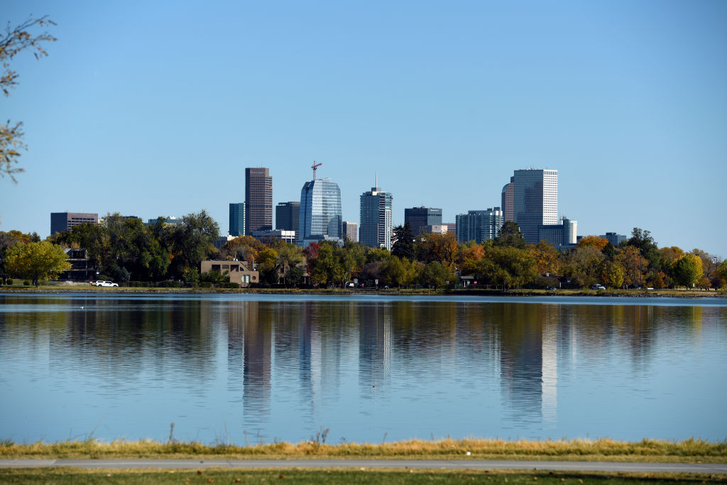 DENVER, CO - MAY 17: Denver Skyline reflected by Sloans Lake on October 17, 2017 photographed from ...