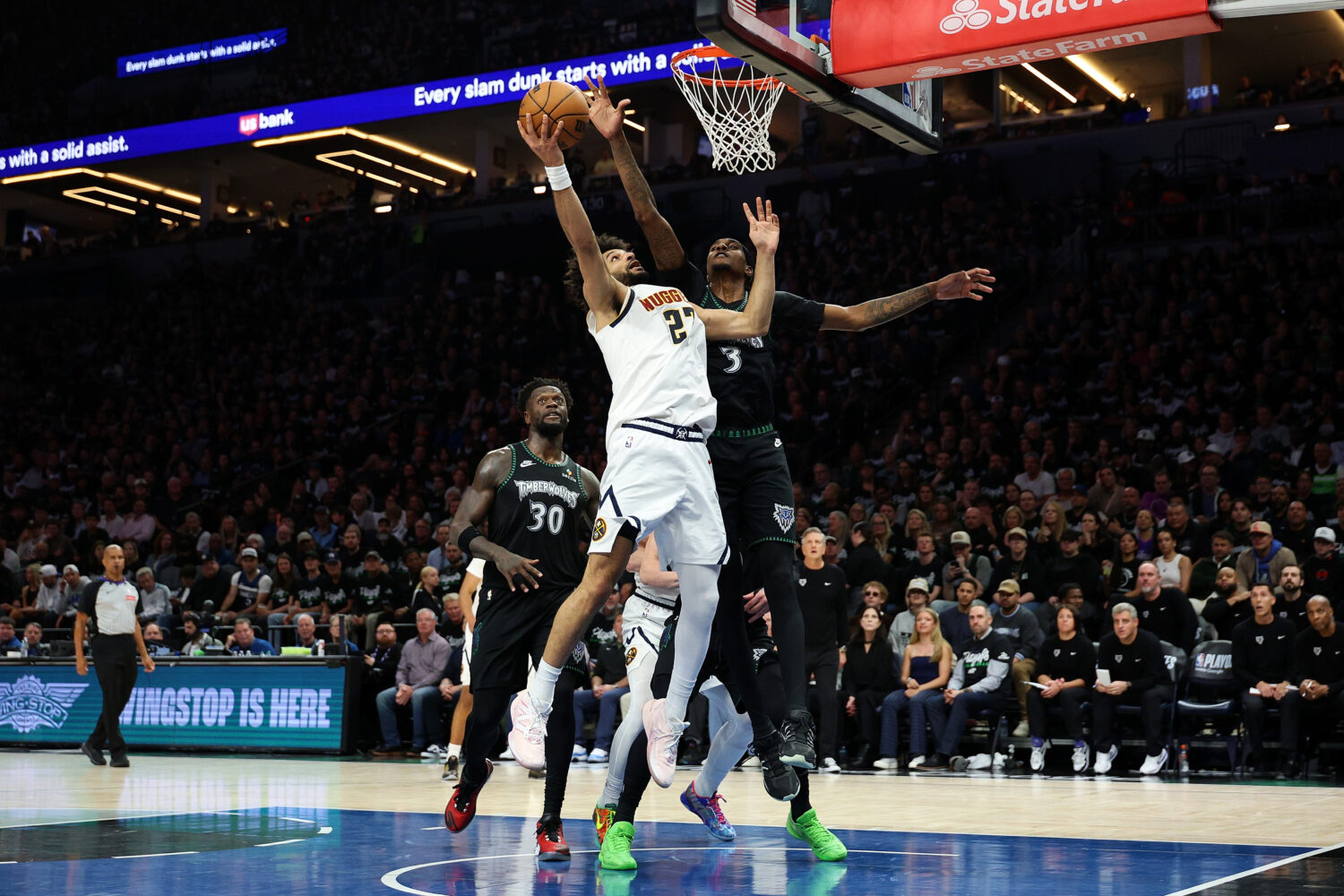 MINNEAPOLIS, MINNESOTA - APRIL 23: Jamal Murray #27 of the Denver Nuggets goes up for a shot agains...