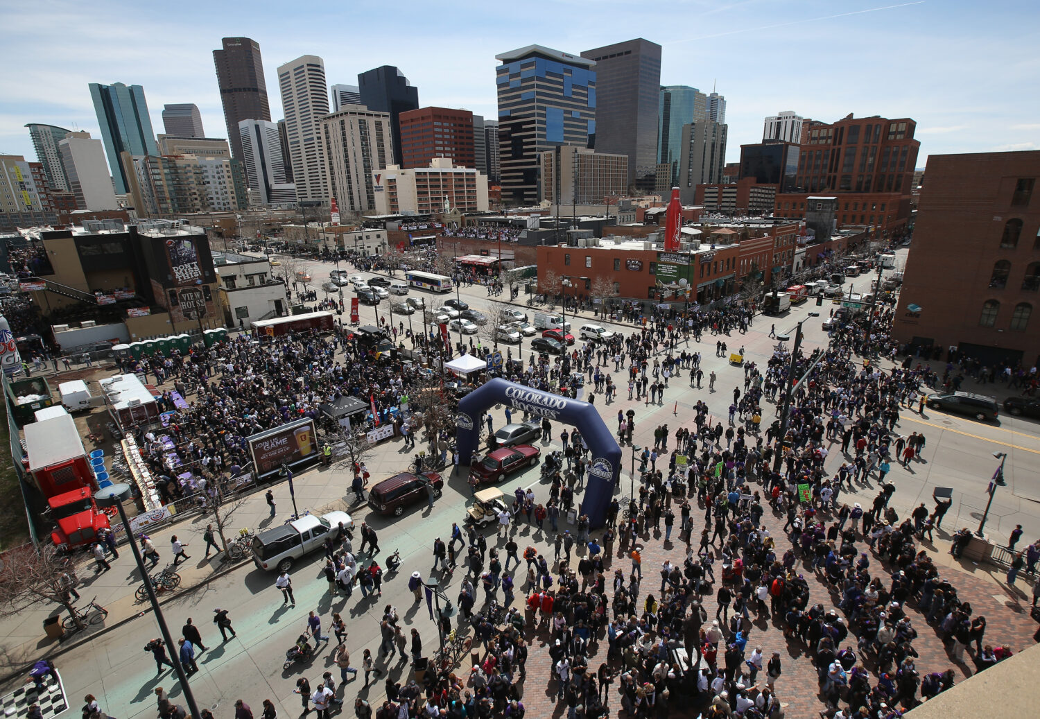 DENVER, CO - APRIL 04:  Fans flood the intersection of Blake Street and 20th Street as they head in...