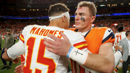 DENVER, COLORADO - NOVEMBER 16: Patrick Mahomes #15 of the Kansas City Chiefs hugs Bo Nix #10 of th...