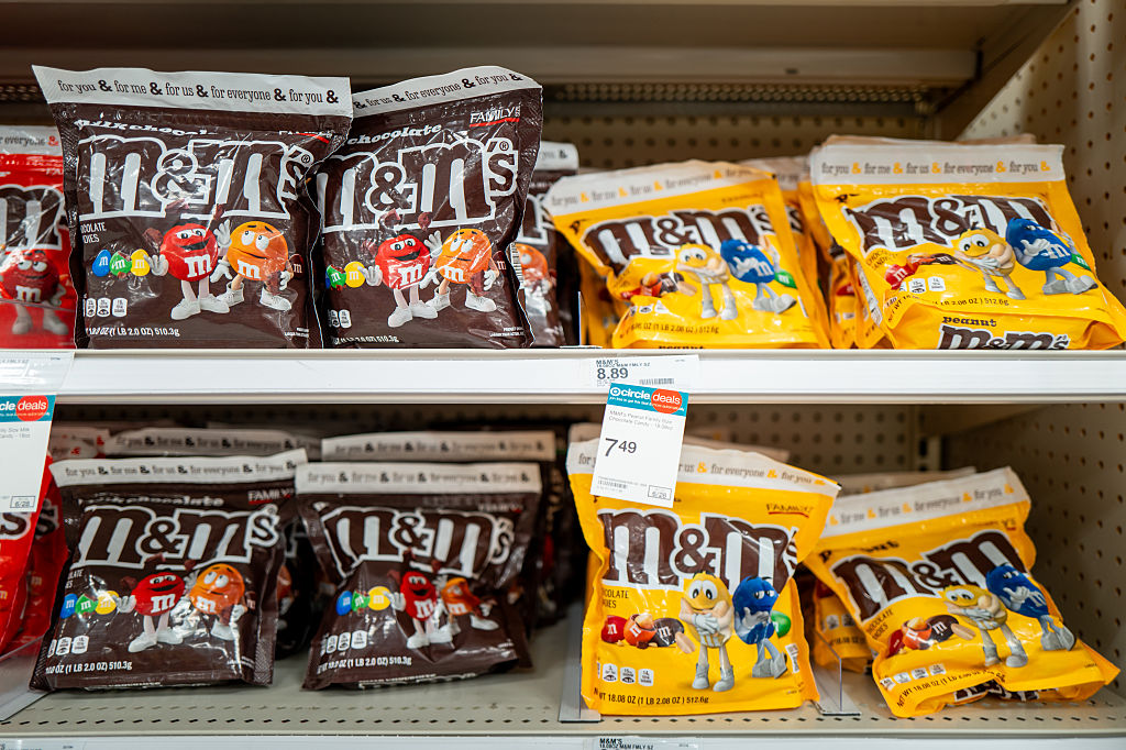 AUSTIN, TEXAS - JUNE 04: Bags of M&M candy sit on shelves at a Target store on June 04, 2025 in...