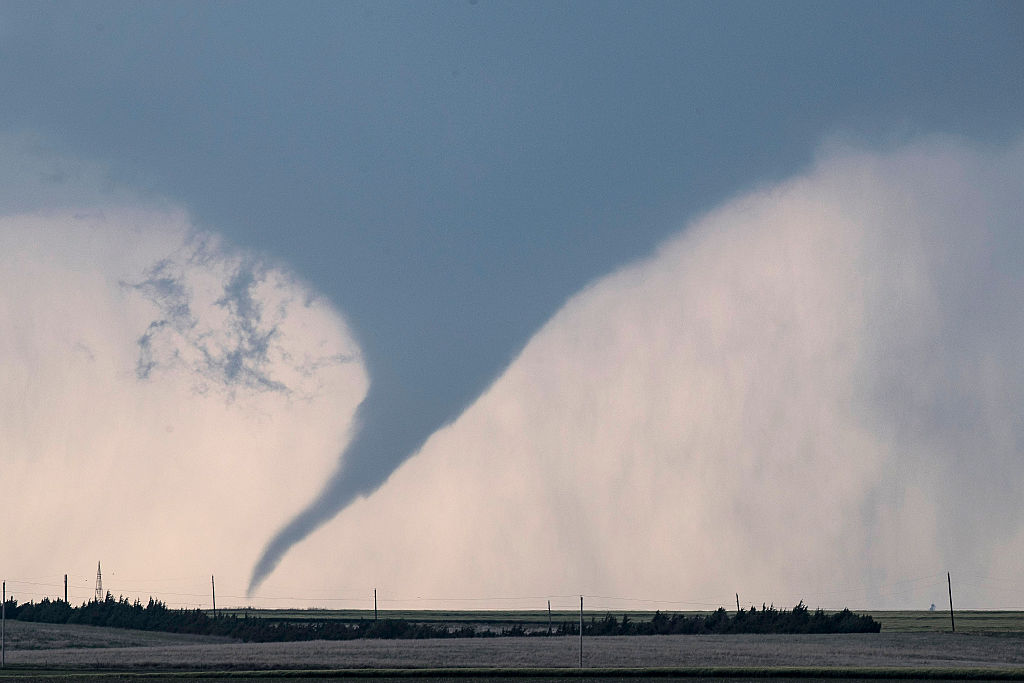 DODGE CITY, KS - MAY 24: A tornado is seen south of Dodge City, Kansas moving north on May 24, 2016...