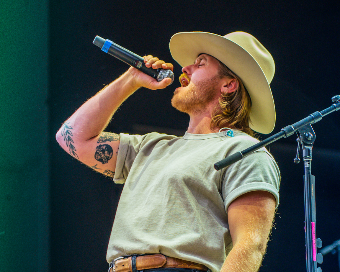 Corey Kent performs onstage for 98.5 KYGO Birthday Bash at Fiddlers Green Amphitheatre on July 6, 2...