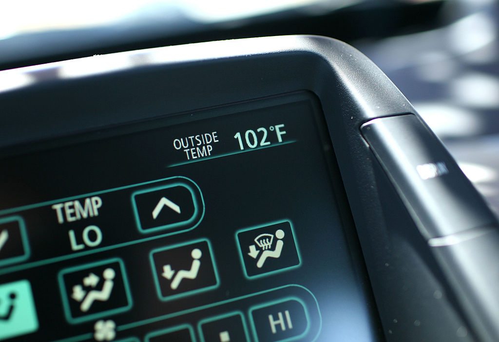 PETALUMA, CA - JUNE 20:  A car thermometer displays an outside temperature of 102 degrees June 20, ...