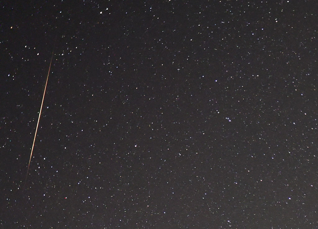 VALLEY OF FIRE STATE PARK, NEVADA - MAY 30: A close-up view shows a meteor streaking across the sky...