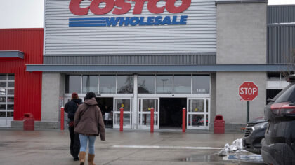 CHICAGO, ILLINOIS - DECEMBER 02: Customers walk in the parking lot outside a Costco store on Decemb...