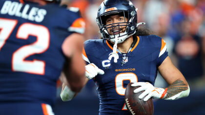 DENVER, COLORADO - SEPTEMBER 27: Talanoa Hufanga #9 of the Denver Broncos celebrates an interceptio...