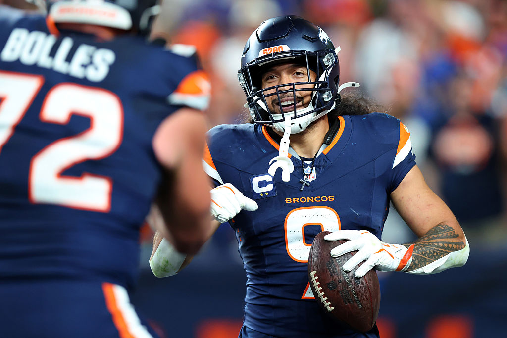 DENVER, COLORADO - SEPTEMBER 27: Talanoa Hufanga #9 of the Denver Broncos celebrates an interceptio...