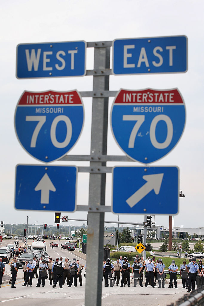 FERGUSON, MO - SEPTEMBER 10:  Police block demonstrators from gaining access to Interstate Highway ...