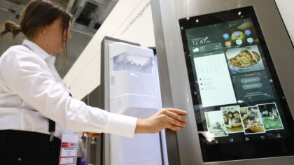 BERLIN, GERMANY - AUGUST 30: Visitors look at the Samsung Home appliance smart Fridge at the 2018 I...