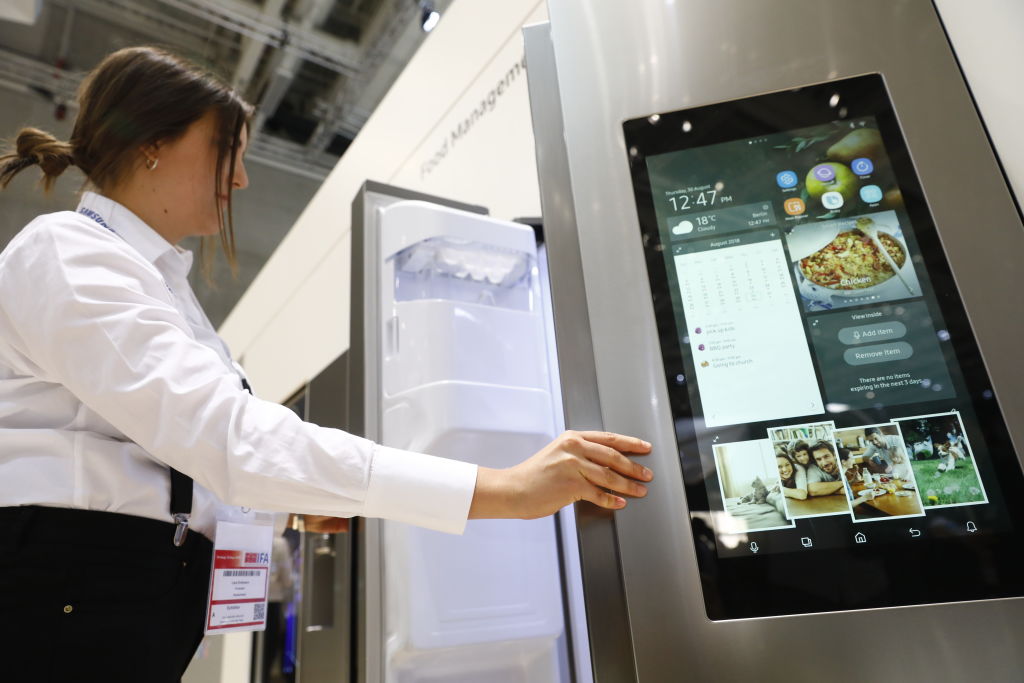 BERLIN, GERMANY - AUGUST 30: Visitors look at the Samsung Home appliance smart Fridge at the 2018 I...