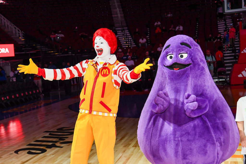 HOUSTON, TEXAS - APRIL 02: Perfromers in "Ronald McDonald" and "Grimace" costumes attend the 47th a...
