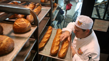 SAN FRANCISCO - APRIL 21:  Boudin Bakery master baker Fernando Padilla checks loaves of freshly bak...